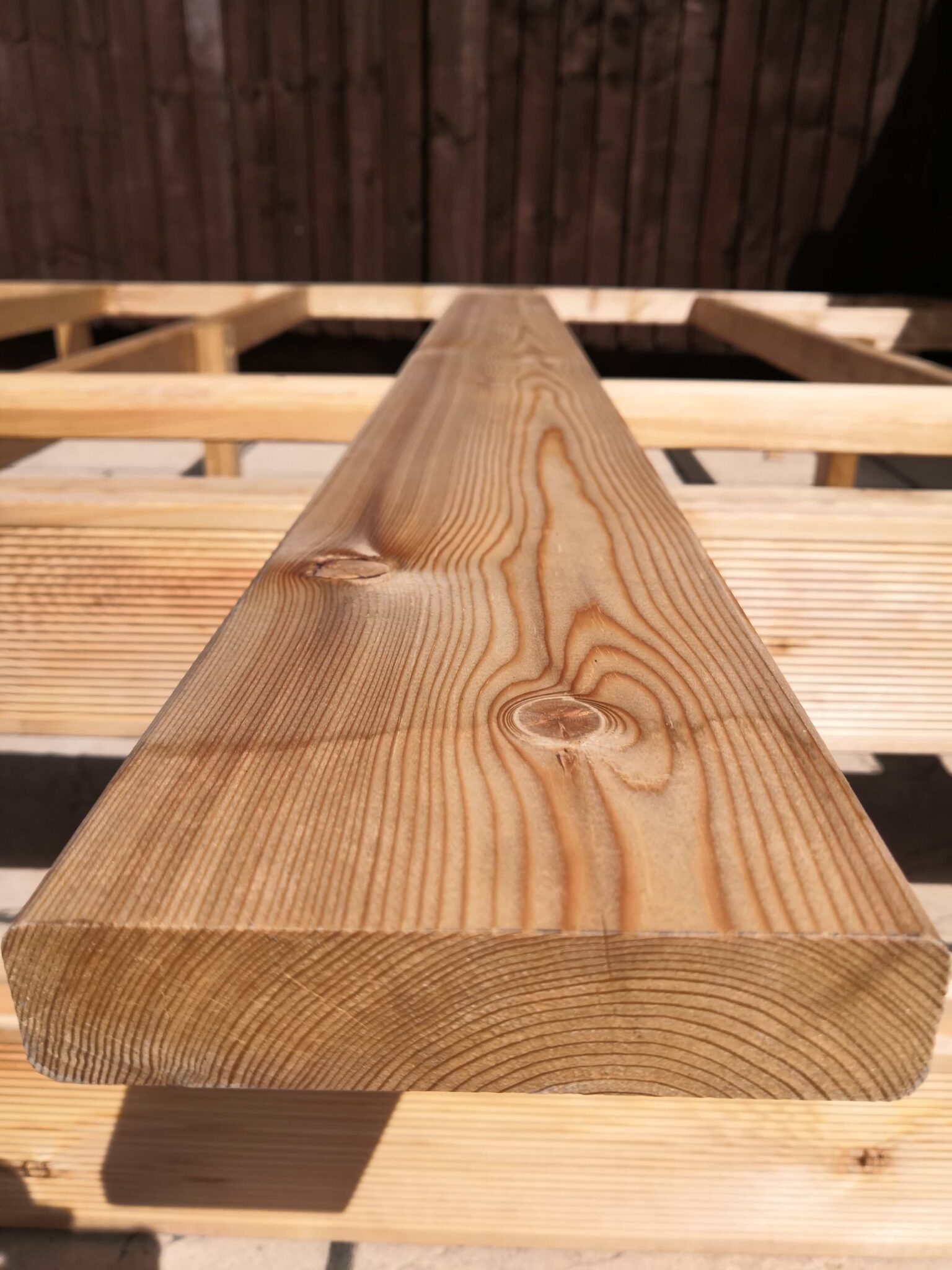 Siberian larch smooth timber decking boards - The Larch Barn